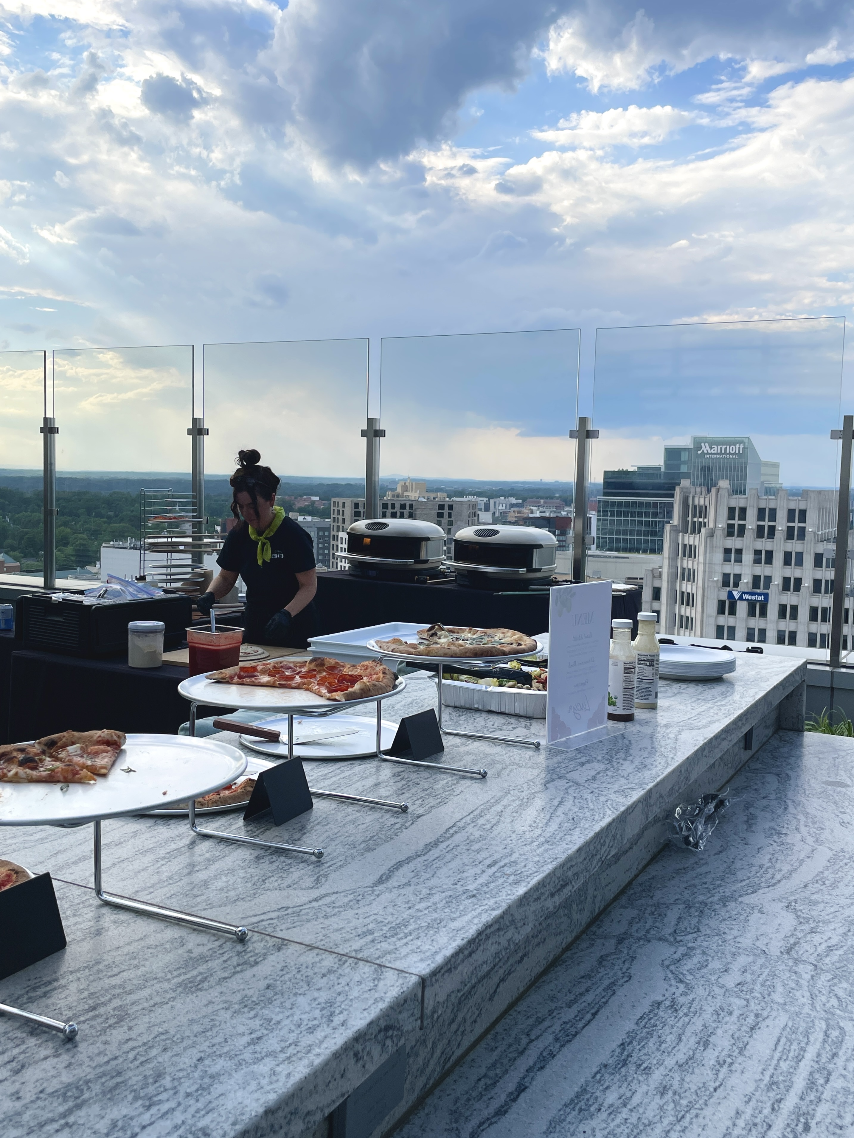 Pizzeria Coco team serving wood-fired pizza at a corporate event