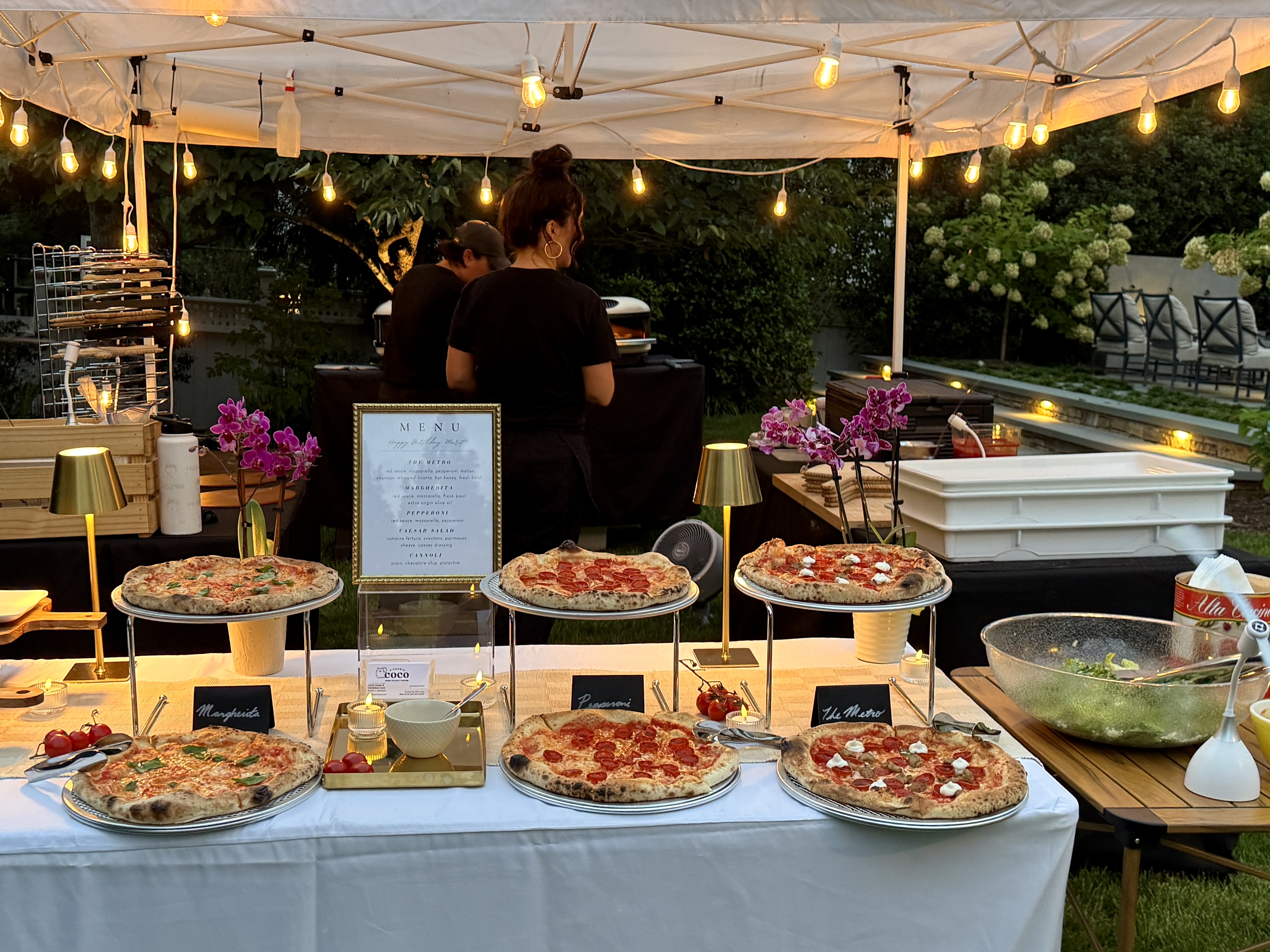 Pizzeria Coco outdoor tent and serving station set up at a catered event